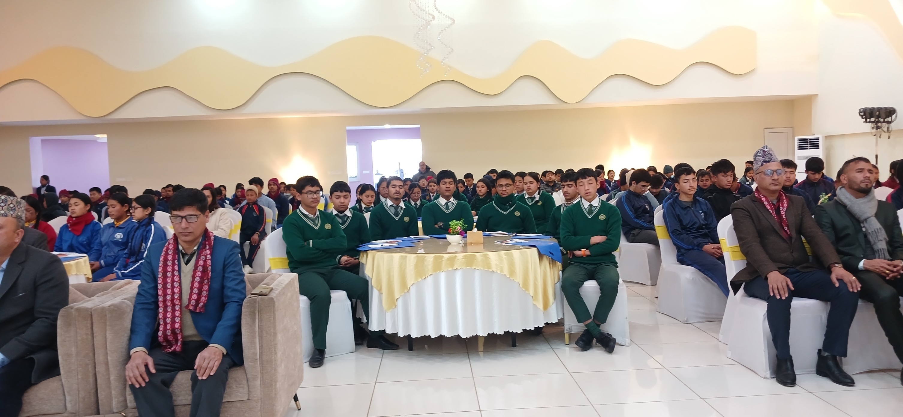 Students and guests seated at a school career event